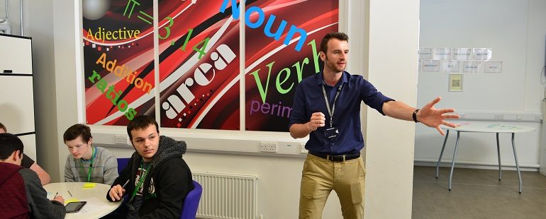 Man teaching maths and English